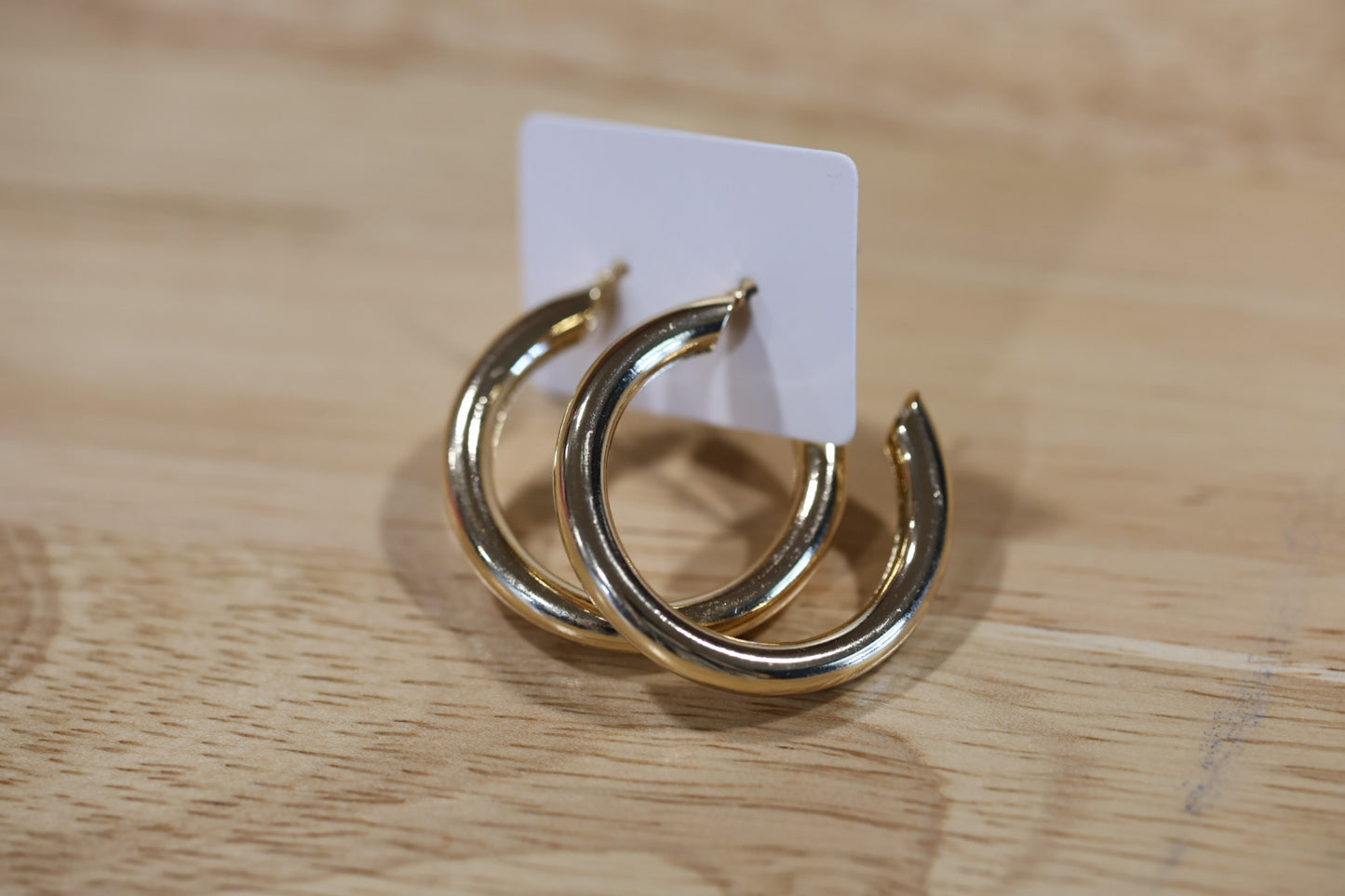 Medium half hoop gold earrings